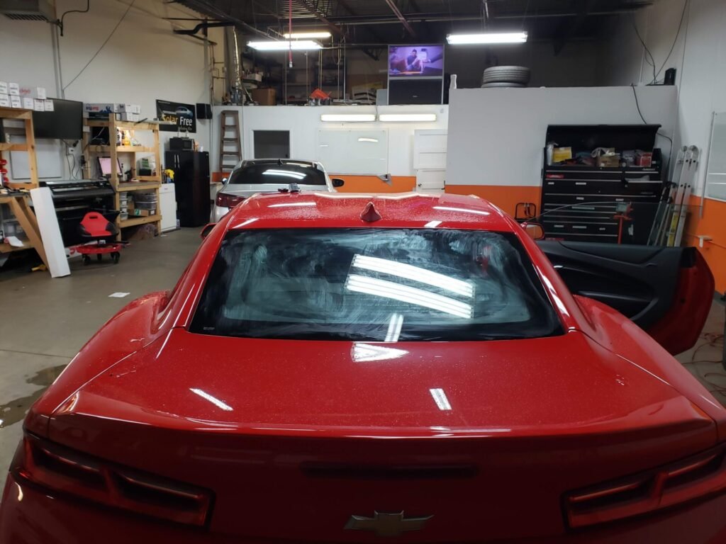 A photo of a red car inside the shop