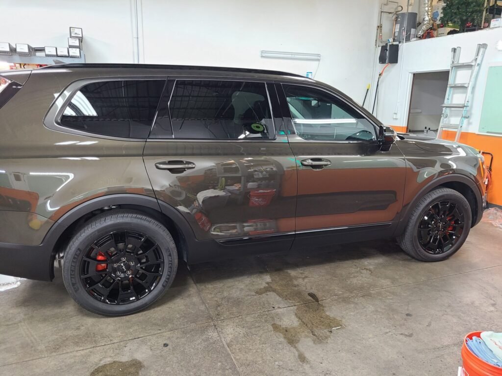 A brown car inside the car shop