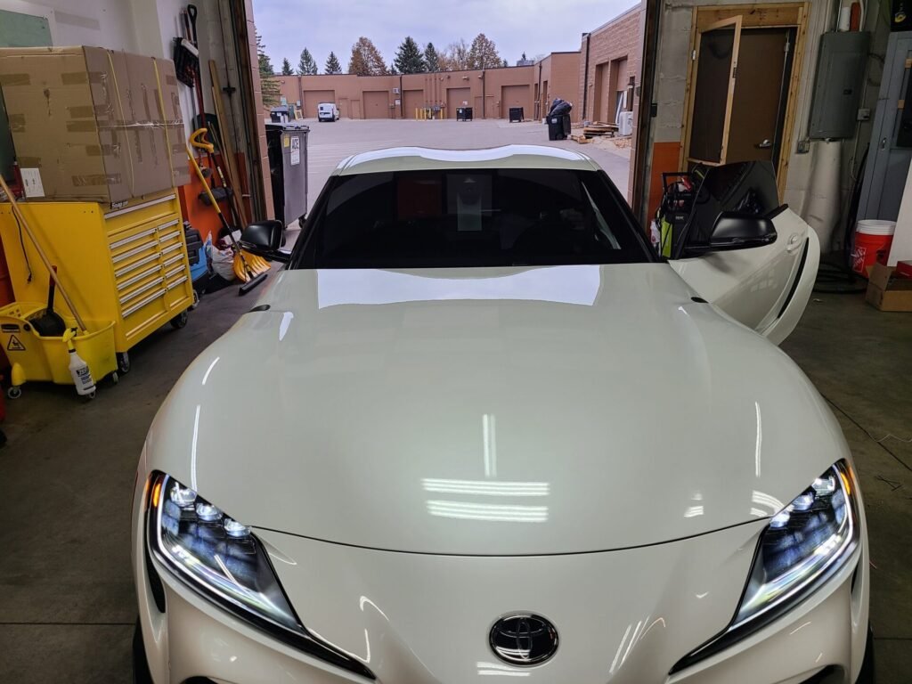 A front of a white car