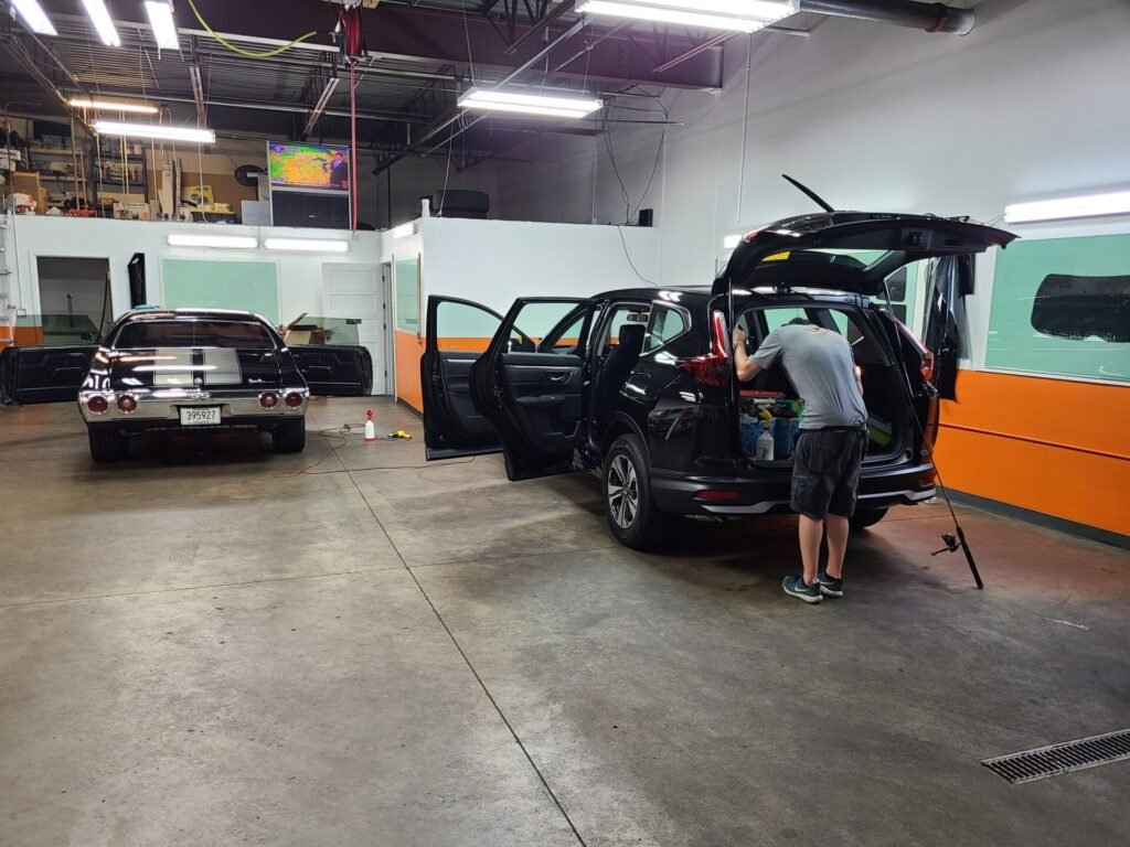 A person cleaning a car